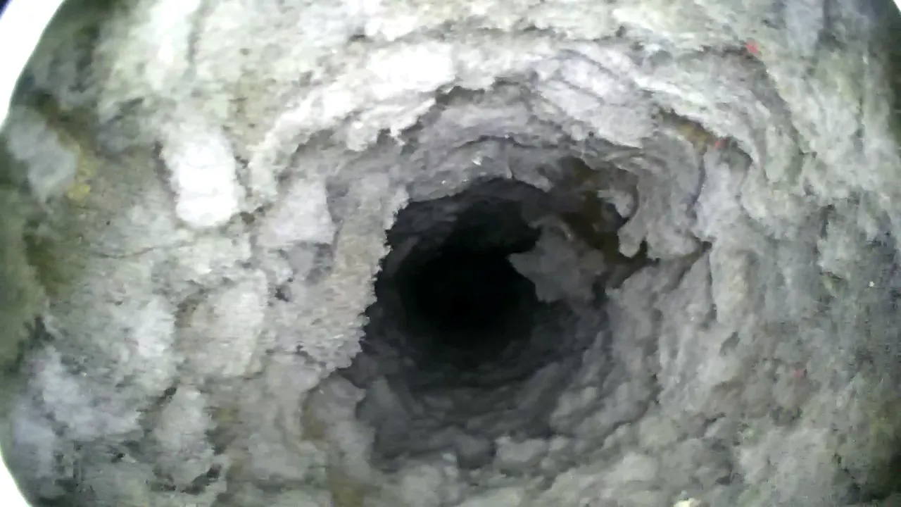 Camera view inside the dryer duct in Toms River with lint coating the walls