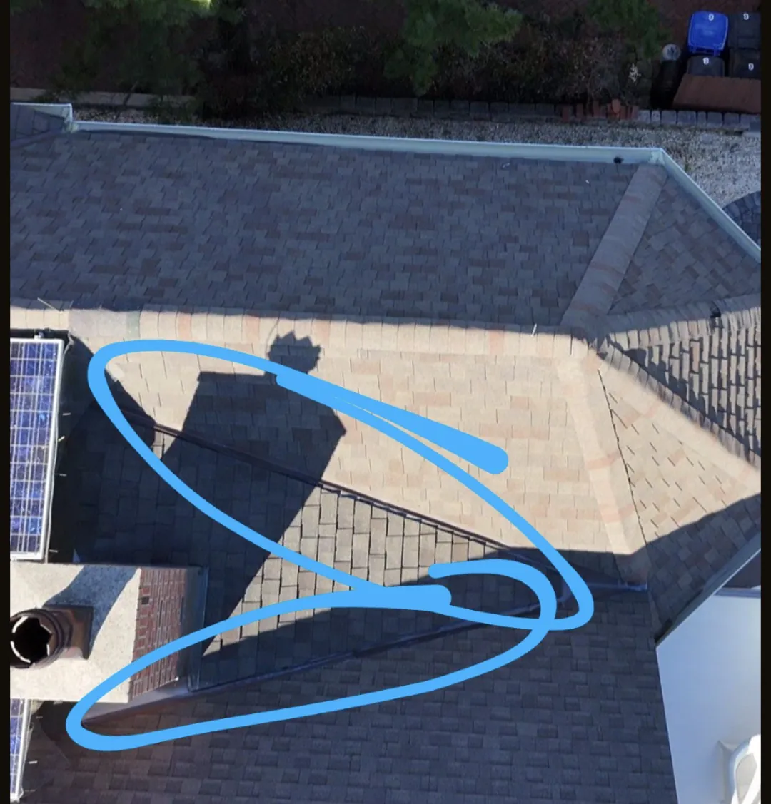 The valley flashing (circled) where we saw the first signs of a leak during a quarterly visit in Lavallette