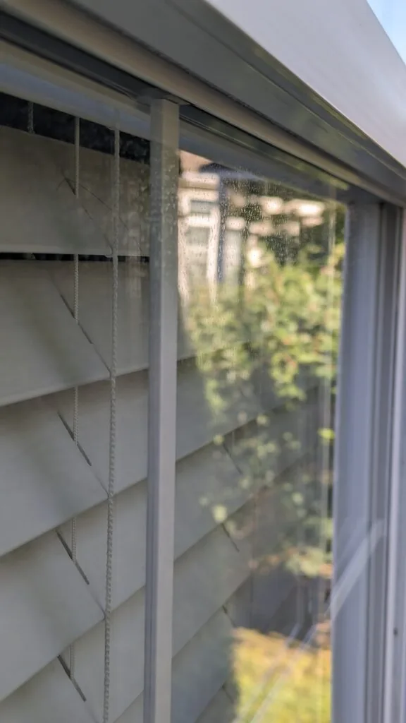 Before: A window before and after cleaning. Glass, frame, sill, and screen all done.
