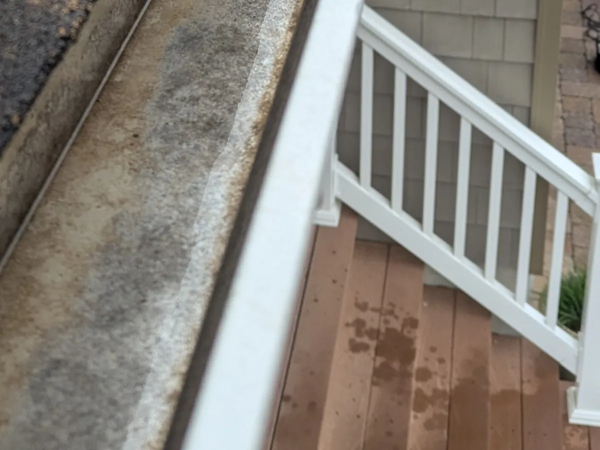 After: Gutter cleaning in Point Pleasant, NJ, April 19, 2026. Leaves, roof grit, and black sludge out, water running clear.