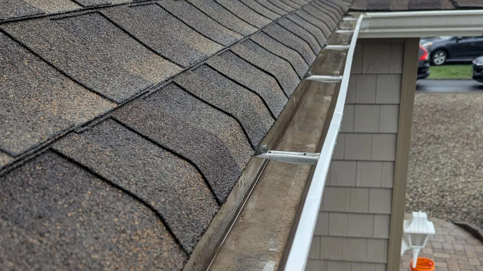 Clean gutter and the deck below it on a Point Pleasant, NJ roofline after gutter cleaning