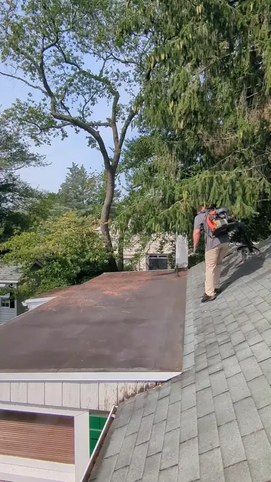 Clearing a garage roof and gutters in Toms River, NJ